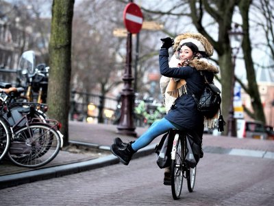 Ride a bike around the city in Amsterdam