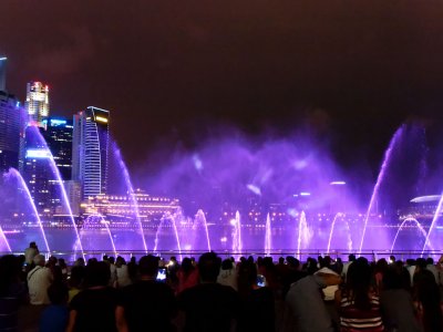 Watch fountain light show in Singapore